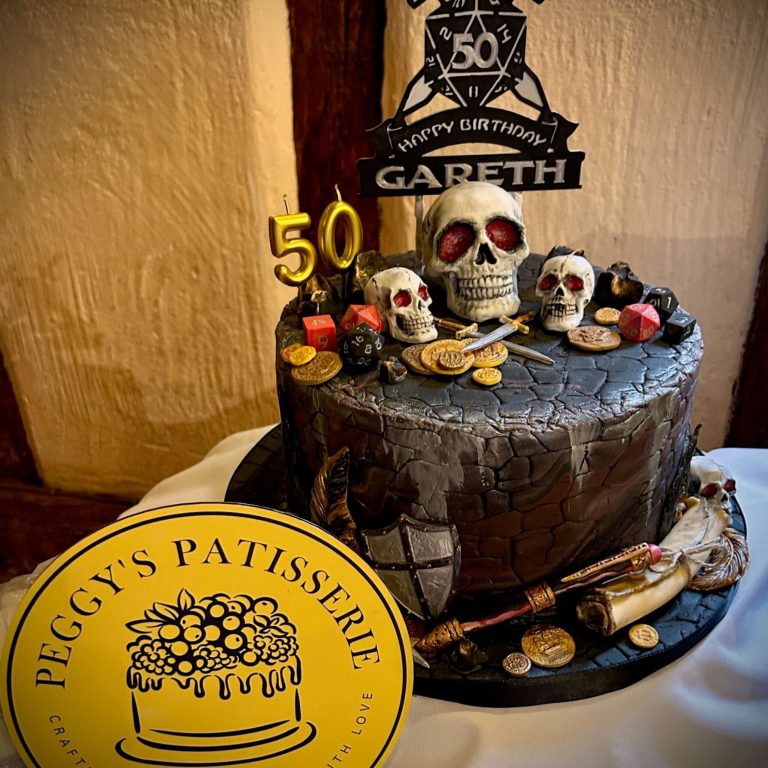 Happy woman with candle-lit birthday cake Happy woman with candle-lit birthday cake