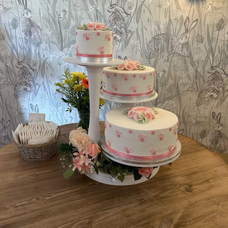 Happy wedding couple cutting wedding cake Happy wedding couple cutting wedding cake
